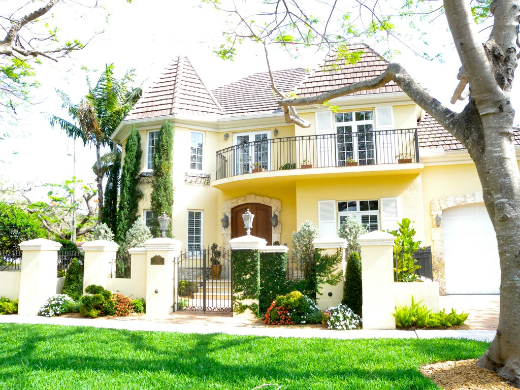 Upscale tree-lined Florida neighborhood home exterior with elegant landscaping for a Viera walkable lifestyle and town center access guide