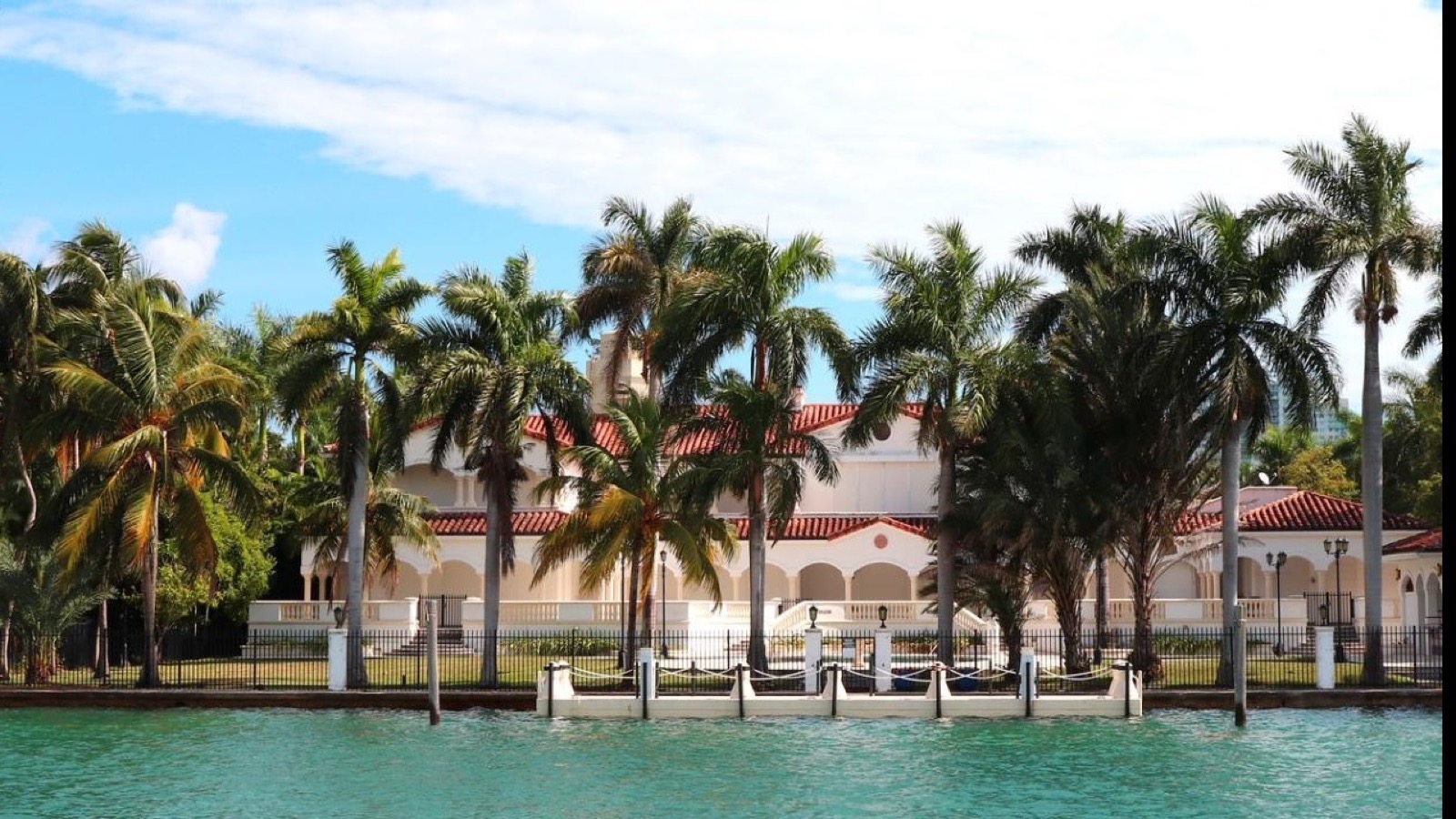 Luxury waterfront Florida home with palm trees for a Viera ownership cost and CDD planning guide