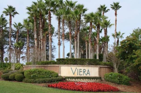Viera monument sign framed by palms and landscaping