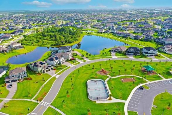 Aerial view of a Viera neighborhood with homes, lakes, sidewalks and recreation space
